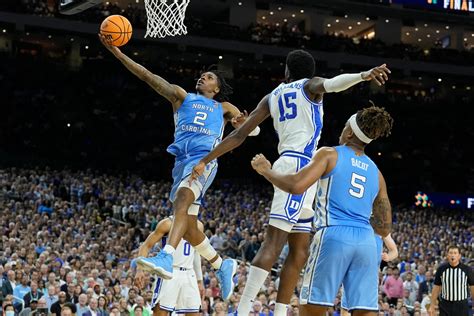 Kansas vs. unc - The first meeting between the Tar Heels and Jayhawks was a triple-overtime NCAA title game in 1957, with UNC capping an unbeaten season by outlasting Wilt Chamberlain and Kansas 54-53.